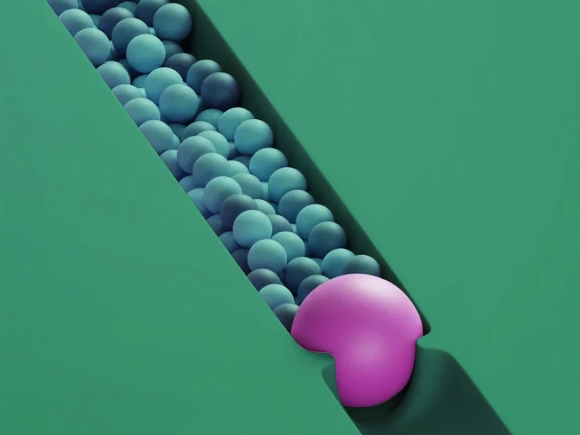 A pink Pac-Man shape blocking a diagonal line of blue spheres on a green background.