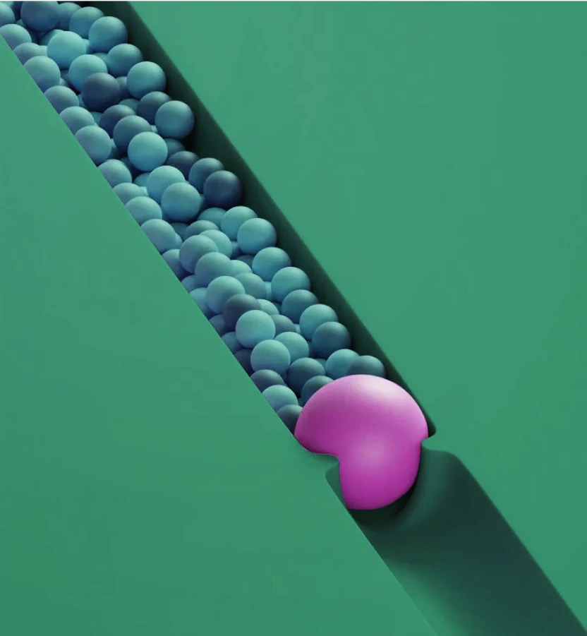 A pink Pac-Man shape blocking a diagonal line of blue spheres on a green background.